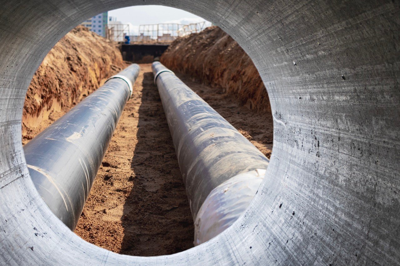 modern-water-supply-sewerage-system-underground-pipeline-works-water-supply-wastewater-disposal-residential-city-closeup-underground-utilities-view-from-big-pipe-Grande.jpeg
